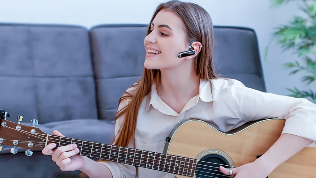 Woman playing guitar while using the New Bee Bluetooth V5.0 Headset