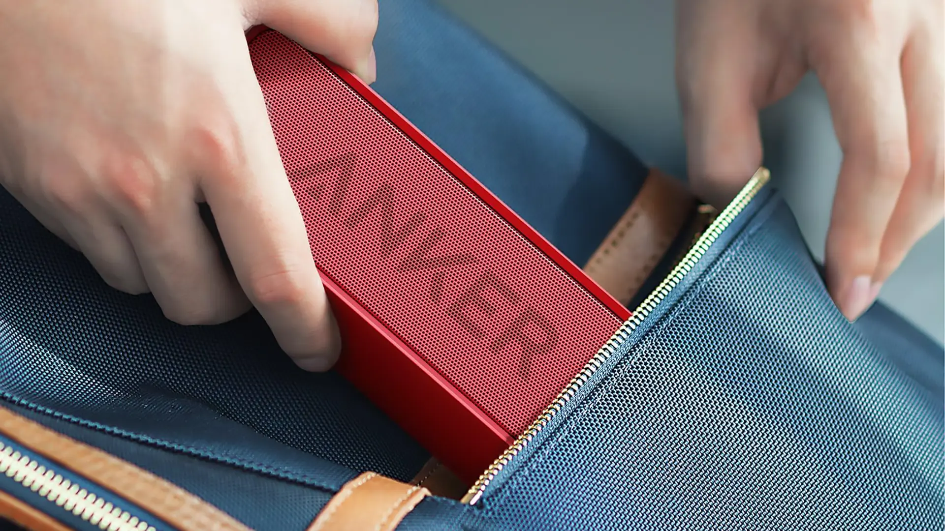 Anker SoundCore Bluetooth speaker in red showing relative size and portability qtooth review